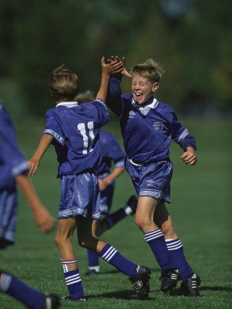 '11 Year Old Boys Soccer Player Celebates a Goal' Photographic Print