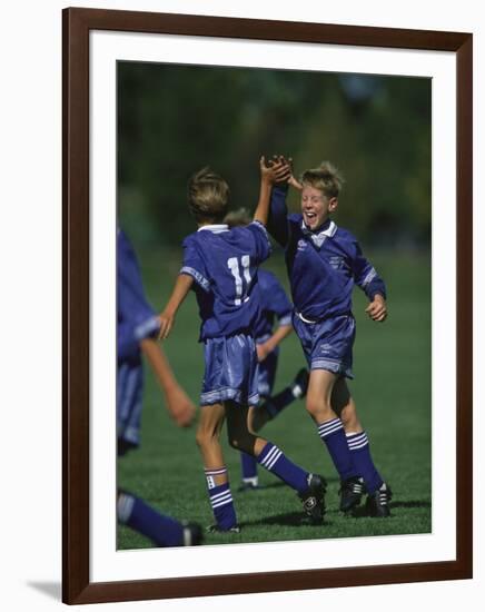 11 Year Old Boys Soccer Player Celebates a Goal-null-Framed Photographic Print