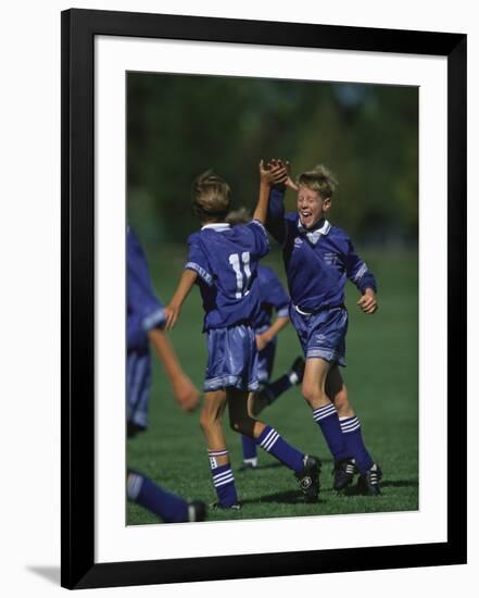 11 Year Old Boys Soccer Player Celebates a Goal-null-Framed Photographic Print