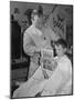 12 Year Old Boy Sitting in Barber Chair Having His Hair Cut and Reading Comics-Alfred Eisenstaedt-Mounted Photographic Print