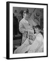 12 Year Old Boy Sitting in Barber Chair Having His Hair Cut and Reading Comics-Alfred Eisenstaedt-Framed Photographic Print