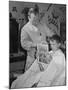 12 Year Old Boy Sitting in Barber Chair Having His Hair Cut and Reading Comics-Alfred Eisenstaedt-Mounted Photographic Print