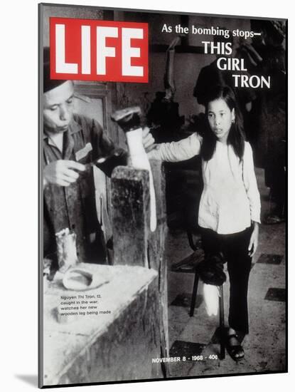 12-Year-Old Vietnamese Girl Nguyen Thi Tron Watching New Wooden Leg Being Made, November 8, 1968-Larry Burrows-Mounted Photographic Print
