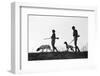 1920s 1930s ANONYMOUS SILHOUETTE MAN AND WOMAN HUNTERS CARRYING GUNS EACH WITH A HUNTING DOG-H. Armstrong Roberts-Framed Photographic Print