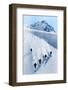 1920s 1930s FIVE ANONYMOUS MEN SKIING DOWN SNOW COVERED ALPS SWITZERLAND-H. Armstrong Roberts-Framed Photographic Print