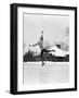 1920s 1930s MAN ICE SKATING ON OUTDOOR ICE RINK DOING AN ARABESQUE JUMPING-Panoramic Images-Framed Photographic Print