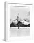 1920s 1930s MAN ICE SKATING ON OUTDOOR ICE RINK DOING AN ARABESQUE JUMPING-Panoramic Images-Framed Photographic Print