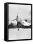 1920s 1930s MAN ICE SKATING ON OUTDOOR ICE RINK DOING AN ARABESQUE JUMPING-Panoramic Images-Framed Stretched Canvas