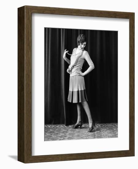 1920s FLAPPER WOMAN POSING HAND ON HIP HOLDING STRING OF PEARLS STRETCHING LEG CHECKING HOSIERY...-Panoramic Images-Framed Photographic Print
