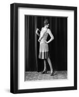 1920s FLAPPER WOMAN POSING HAND ON HIP HOLDING STRING OF PEARLS STRETCHING LEG CHECKING HOSIERY...-Panoramic Images-Framed Photographic Print