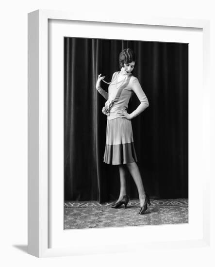 1920s FLAPPER WOMAN POSING HAND ON HIP HOLDING STRING OF PEARLS STRETCHING LEG CHECKING HOSIERY...-Panoramic Images-Framed Photographic Print