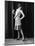 1920s FLAPPER WOMAN POSING HAND ON HIP HOLDING STRING OF PEARLS STRETCHING LEG CHECKING HOSIERY...-Panoramic Images-Mounted Photographic Print