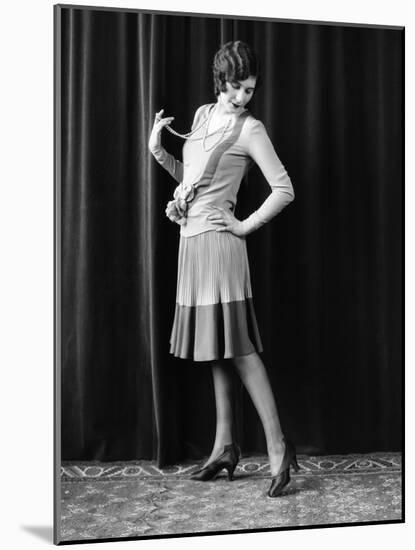 1920s FLAPPER WOMAN POSING HAND ON HIP HOLDING STRING OF PEARLS STRETCHING LEG CHECKING HOSIERY...-Panoramic Images-Mounted Photographic Print