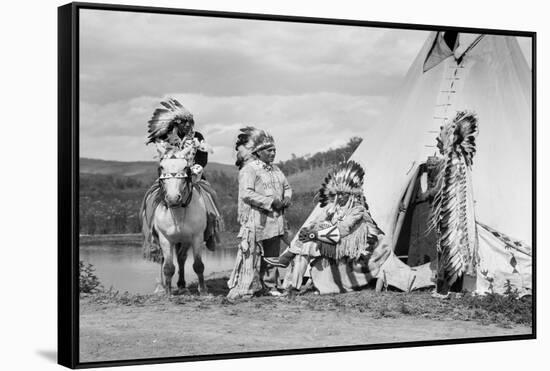 1920s FOUR NATIVE AMERICAN STONEY SIOUX INDIAN MEN ASSEMBLED BESIDE TEPEE WEARING FULL EAGLE FEA...-H. Armstrong Roberts-Framed Stretched Canvas