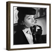 1930s 1940s ELEGANT UPSCALE WOMAN WEARING HAT WITH VEIL SNIFFING BOTTLE OF WHIMSY PERFUME-Panoramic Images-Framed Photographic Print