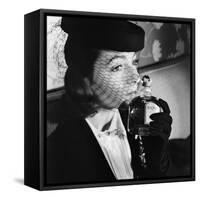 1930s 1940s ELEGANT UPSCALE WOMAN WEARING HAT WITH VEIL SNIFFING BOTTLE OF WHIMSY PERFUME-Panoramic Images-Framed Stretched Canvas