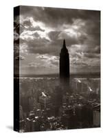 1930s-1940s Empire State Building Silhouetted Against High Gathering Storm Clouds Covering NYC-null-Stretched Canvas