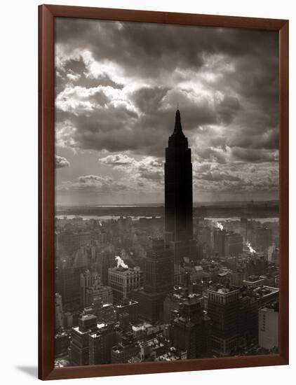 1930s-1940s Empire State Building Silhouetted Against High Gathering Storm Clouds Covering NYC-null-Framed Photographic Print