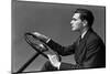 1930s 1940s MAN WEARING SUIT AND TIE DRIVING HANDS ON STEERING WHEEL-H. Armstrong Roberts-Mounted Photographic Print