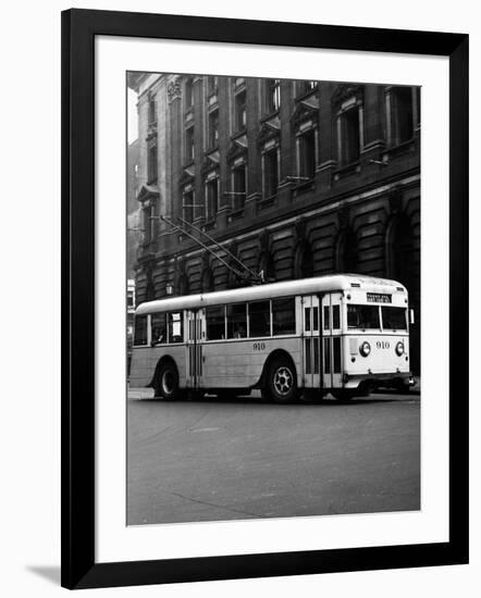 1930s-1940s Public Transportation Trackless Trolley Electric Bus About to Round Street Corner-null-Framed Photographic Print