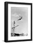 1930s 1940s SHAPELY WOMAN WATCHING MAN SWAN DIVE OFF HIGH DIVING BOARD-H. Armstrong Roberts-Framed Photographic Print