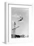 1930s 1940s SHAPELY WOMAN WATCHING MAN SWAN DIVE OFF HIGH DIVING BOARD-H. Armstrong Roberts-Framed Photographic Print