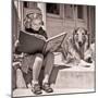 1930s ENGROSSED LITTLE GIRL OUTDOOR READING BIG BOOK SITTING NEXT TO ROUGH COLLIE DOG LOOKING AT...-H. Armstrong Roberts-Mounted Photographic Print