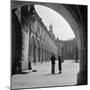 1930s FASHIONABLE ANONYMOUS COUPLE STANDING IN COURTYARD OF AN OLD CASTLE DRESDEN GERMANY-Panoramic Images-Mounted Photographic Print