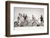 1930s GROUP OF MEN AND WOMEN WEARING BATHING SUITS CASUAL CLOTHES ON BICYCLES IN A CAR ON BEACH...-H. Armstrong Roberts-Framed Photographic Print