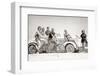 1930s GROUP OF MEN AND WOMEN WEARING BATHING SUITS CASUAL CLOTHES ON BICYCLES IN A CAR ON BEACH...-H. Armstrong Roberts-Framed Photographic Print