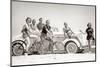 1930s GROUP OF MEN AND WOMEN WEARING BATHING SUITS CASUAL CLOTHES ON BICYCLES IN A CAR ON BEACH...-H. Armstrong Roberts-Mounted Photographic Print