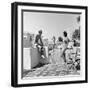 1930s MAN WOMAN WEARING BATHING SUITS ON TERRACE OVERLOOKING SWIMMING POOL WOMAN ON DIVING BOARD-Panoramic Images-Framed Photographic Print