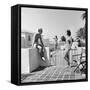 1930s MAN WOMAN WEARING BATHING SUITS ON TERRACE OVERLOOKING SWIMMING POOL WOMAN ON DIVING BOARD-Panoramic Images-Framed Stretched Canvas