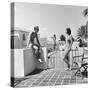 1930s MAN WOMAN WEARING BATHING SUITS ON TERRACE OVERLOOKING SWIMMING POOL WOMAN ON DIVING BOARD-Panoramic Images-Stretched Canvas