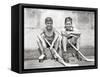 1930s TWO SMILING BOYS STREET HOCKEY PLAYERS SITTING ON CURB WEARING METAL ROLLER SKATES HOLDING...-Panoramic Images-Framed Stretched Canvas