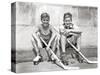 1930s TWO SMILING BOYS STREET HOCKEY PLAYERS SITTING ON CURB WEARING METAL ROLLER SKATES HOLDING...-Panoramic Images-Stretched Canvas