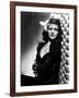 , 1940: American actress Rita Hayworth (1918 - 1987) with an exotic flower in her hair (Photo by A.-null-Framed Photo