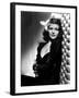 , 1940: American actress Rita Hayworth (1918 - 1987) with an exotic flower in her hair (Photo by A.-null-Framed Photo