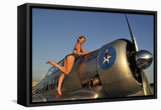 1940's Pin-Up Girl Standing on the Wing of a World War II T-6 Texan-null-Framed Stretched Canvas