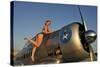 1940's Pin-Up Girl Standing on the Wing of a World War II T-6 Texan-null-Stretched Canvas