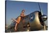 1940's Pin-Up Girl Standing on the Wing of a World War II T-6 Texan-null-Stretched Canvas