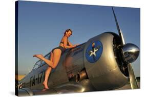 1940's Pin-Up Girl Standing on the Wing of a World War II T-6 Texan-null-Stretched Canvas