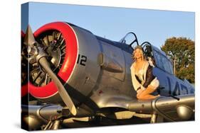 1940's Style Aviator Pin-Up Girl Posing with a Vintage T-6 Texan Aircraft-null-Stretched Canvas