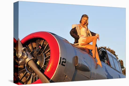 1940's Style Aviator Pin-Up Girl Posing with a Vintage T-6 Texan Aircraft-null-Stretched Canvas