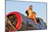 1940's Style Aviator Pin-Up Girl Posing with a Vintage T-6 Texan Aircraft-null-Mounted Premium Photographic Print