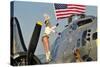 1940's Style Majorette Pin-Up Girl on a B-17 Bomber with an American Flag-null-Stretched Canvas