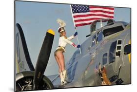 1940's Style Majorette Pin-Up Girl on a B-17 Bomber with an American Flag-null-Mounted Photographic Print