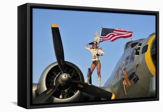 1940's Style Majorette Pin-Up Girl on a B-17 Bomber with an American Flag-null-Framed Stretched Canvas