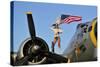 1940's Style Majorette Pin-Up Girl on a B-17 Bomber with an American Flag-null-Stretched Canvas