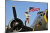 1940's Style Majorette Pin-Up Girl on a B-17 Bomber with an American Flag-null-Mounted Photographic Print